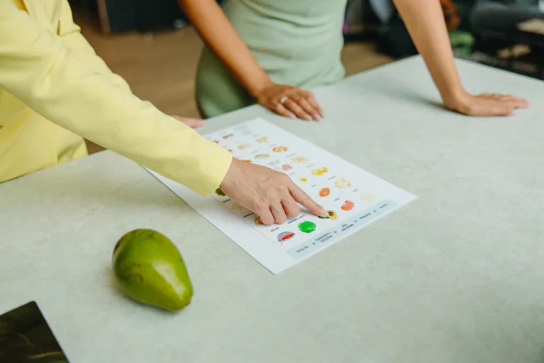 Two person checking paper for healthy meal prep weight loss