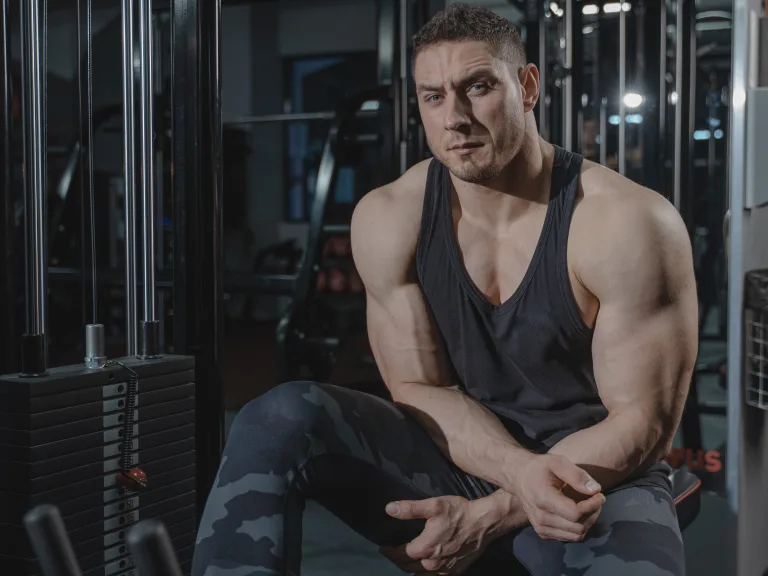 man with big muscles resting after workout cardiac muscle