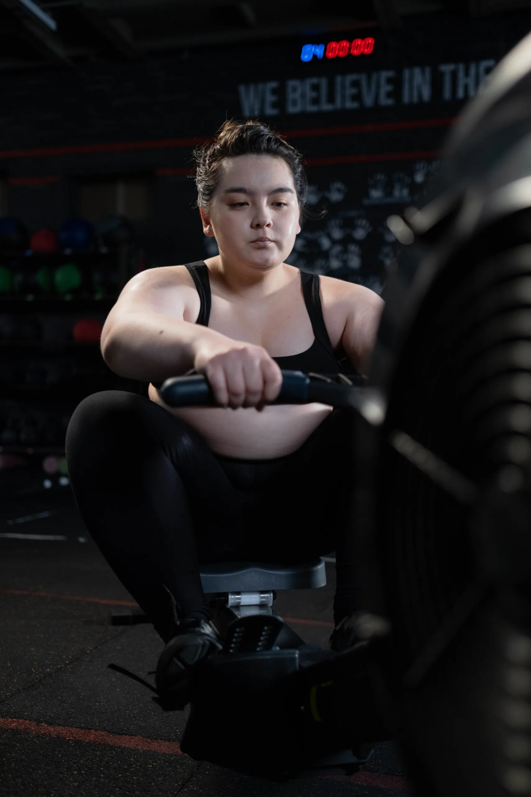 overweight woman doing workout in the gym