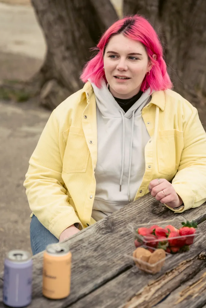 overweight woman eating fruits in the park