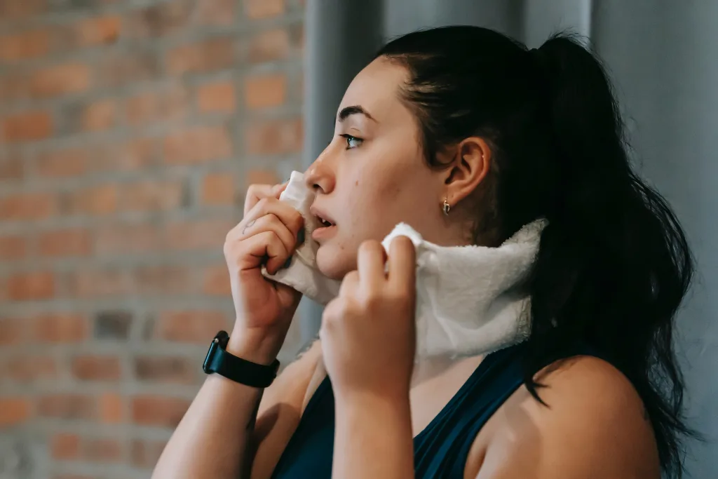 overweight woman wiping her sweat after workout for weight loss Chondromalacia-post-workout