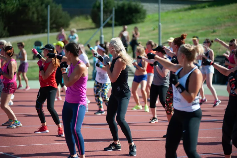 People exercising together outdoors