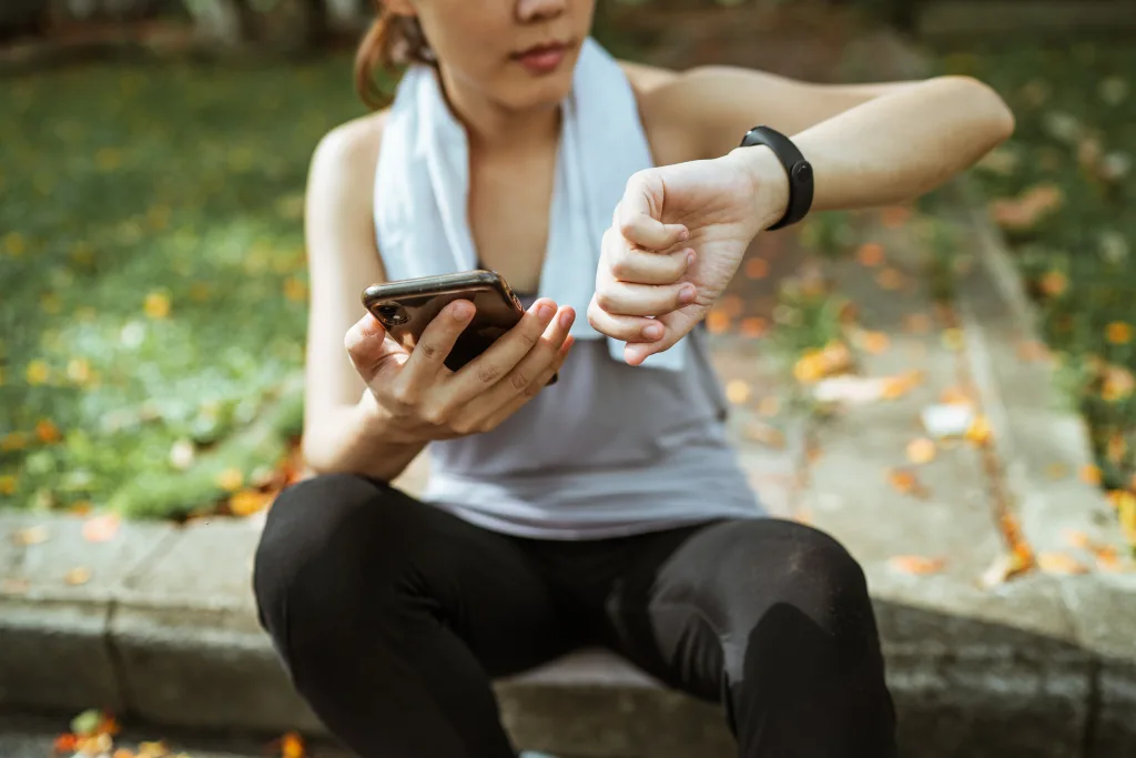 woman checking time after exercising for weight loss
