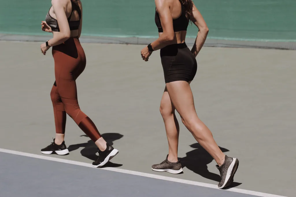 two fit woman jogging for weight loss