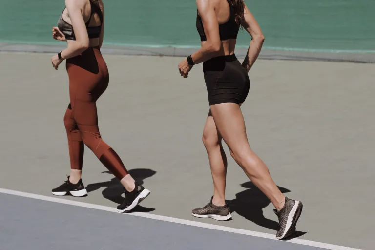 two fit woman jogging for weight loss