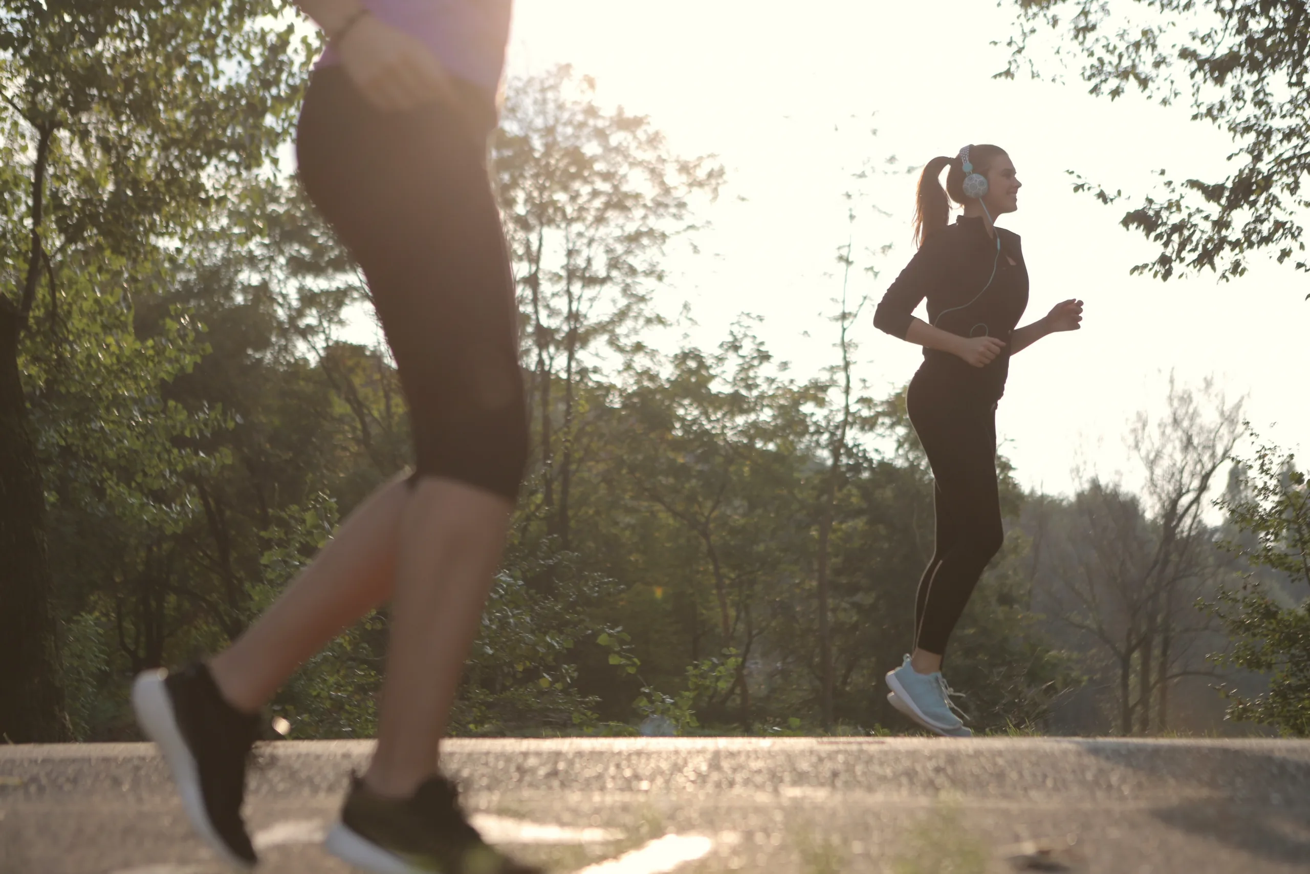 Two women doing morning exercise for calorie tracking