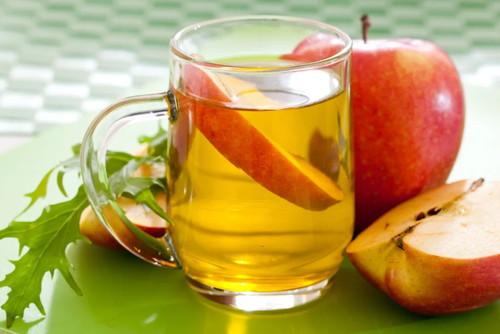 apple cider vinegar (acv) in a green cloth cover