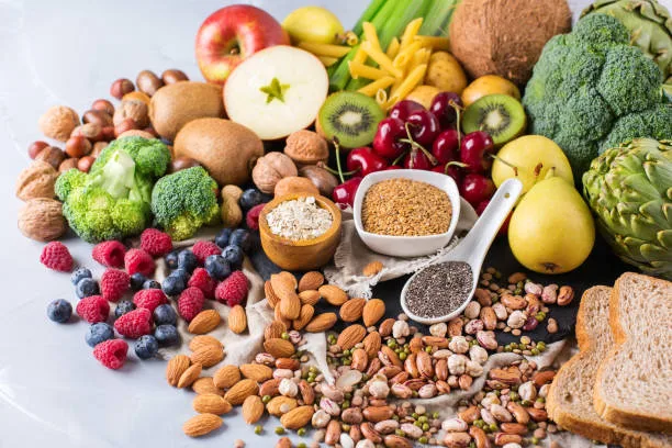 Healthy balanced dieting concept. Selection of rich fiber sources vegan food. Vegetables fruit seeds beans ingredients for cooking.