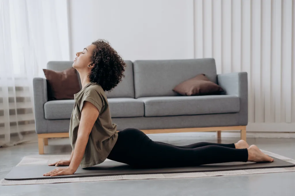 woman-exercising-at-yoga-mat