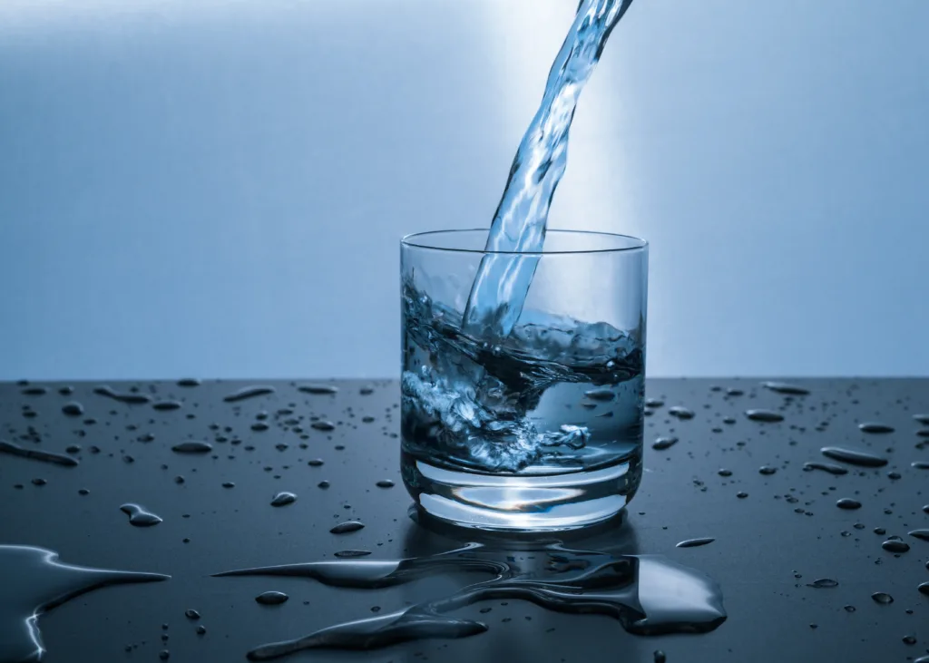 water in a glass drinking more water for hydration weight loss