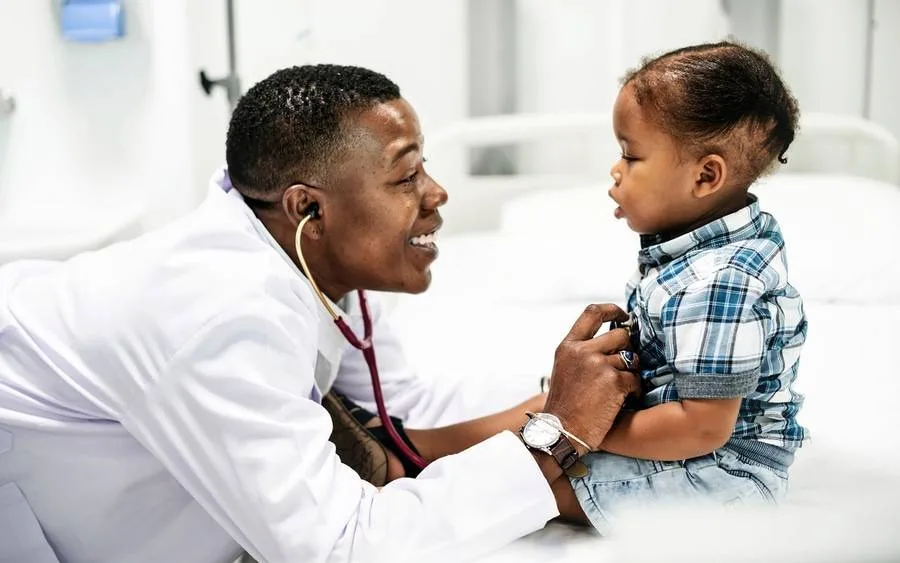 pediatrician-checking-child