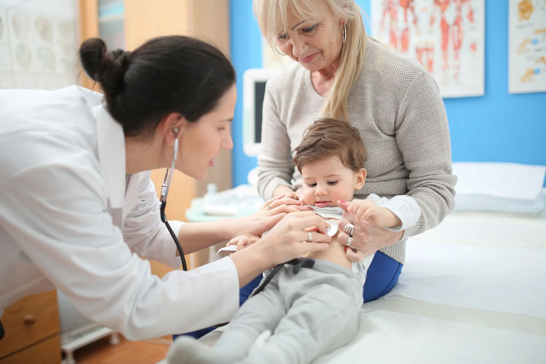 pediatrician checking child