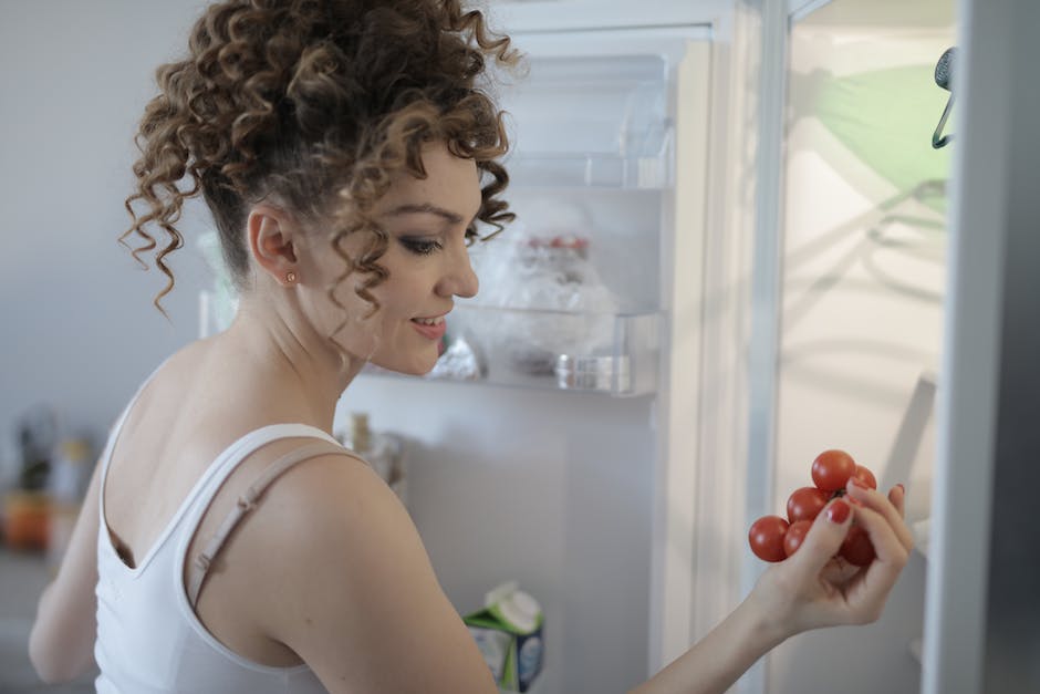 happy woman eating fruits that are good for weight loss