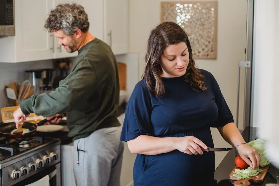 man and woman cooking healthy meal for weight loss