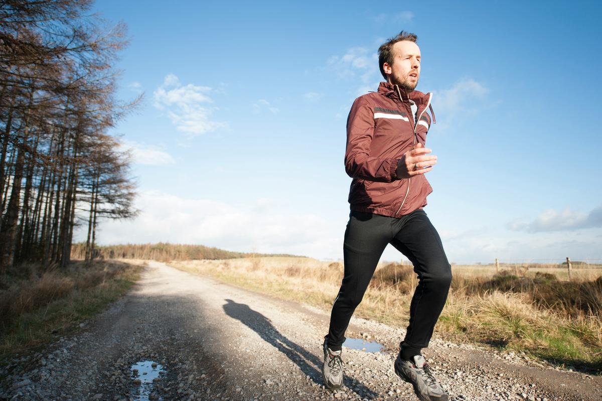 A fit person running and drinking water, with sweat droplets flying, and an infographic showing 12 ounces of water for every 30 minutes of exercise