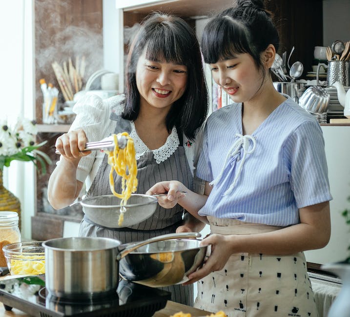 Image depicting a woman preparing a healthy meal.